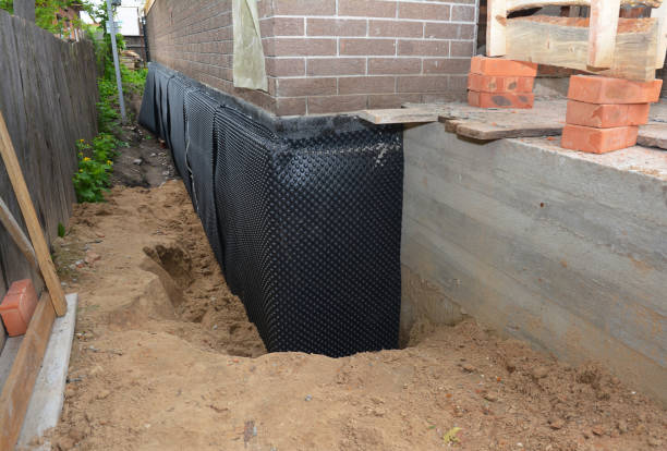 SJ Waterproofing Pros technician performing targeted Sump Pump Installation assessment in Mantoloking, NJ
